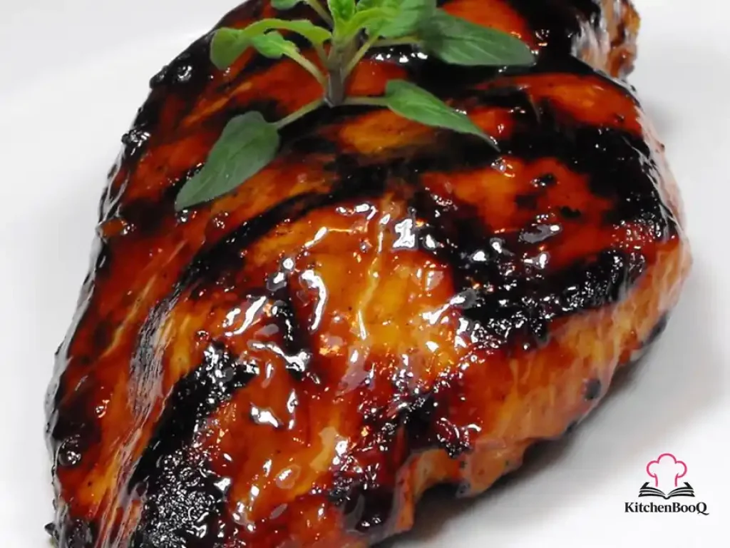 Juicy Asian grilled chicken thighs with caramelized grill marks glazed in a sweet soy and chili marinade, served on a plate with lime wedges