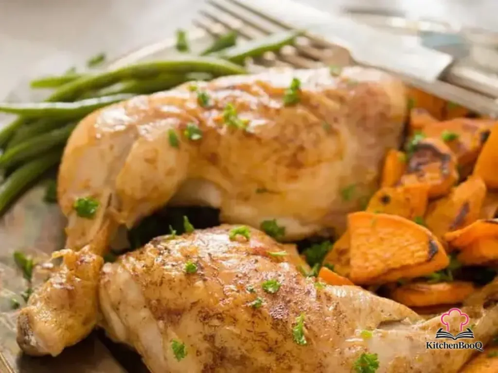Golden crispy baked chicken leg quarters seasoned with sweet and hot Hungarian paprika on a baking tray