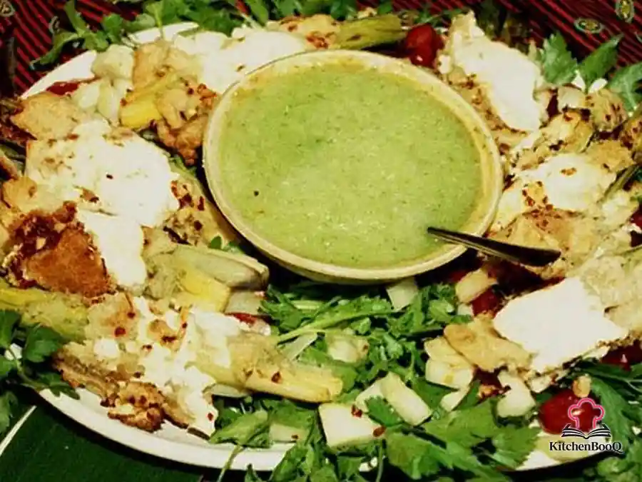 Braised rolled leeks wrapped in golden pie crust strips and filled with creamy cucumber dill ricotta sauce, arranged around a small bowl of cucumber dip on a large serving platter